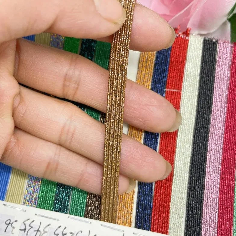 Venta al por mayor de 6 mm de banda elástica de costura de colores dorados y plateados con purpurina, banda elástica para la cintura, cuerda elástica con purpurina de 30 a 6 mm, 144 yardas, 1 rol