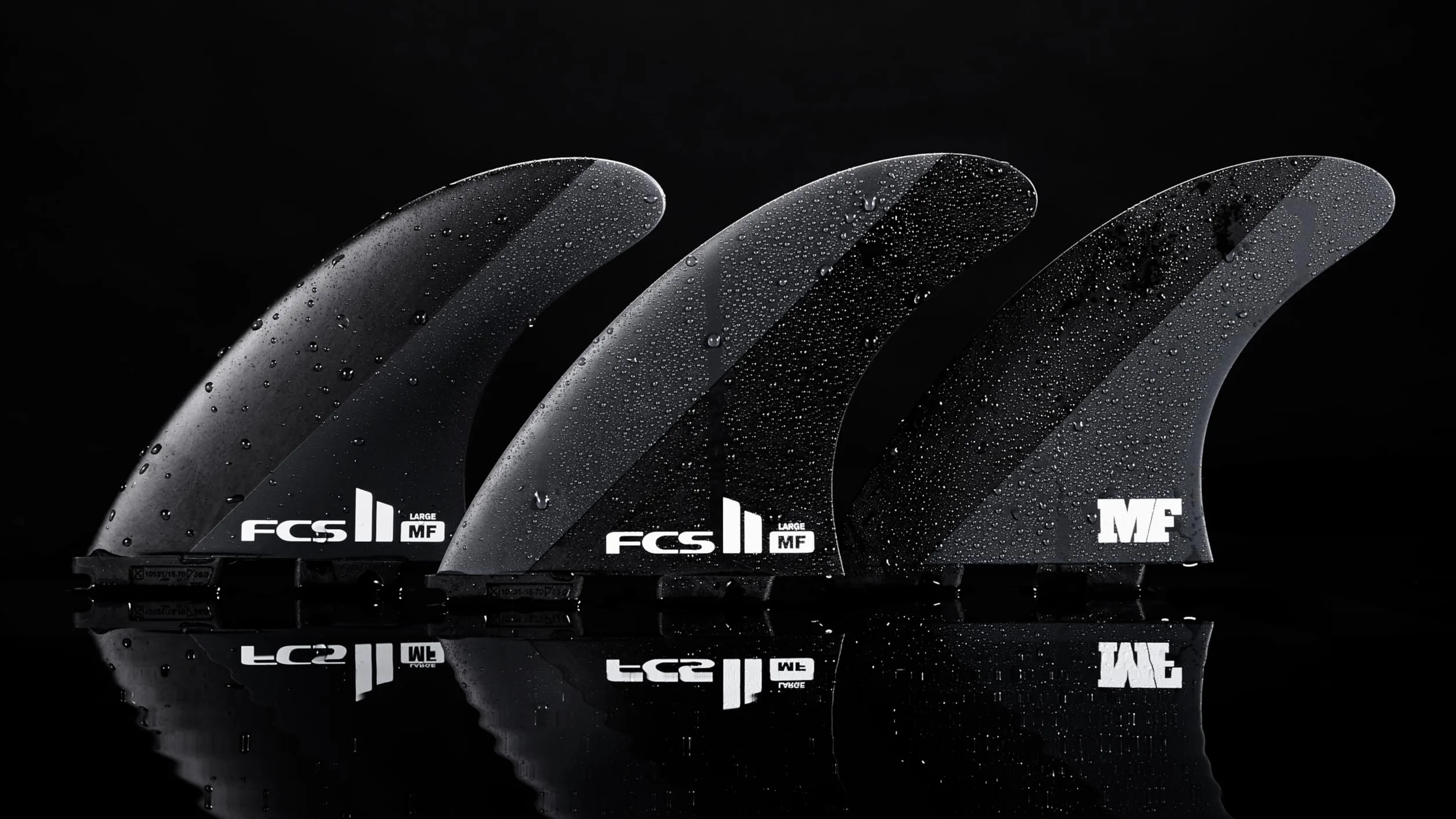 FCS II Mick Fanning Neo Carbon Tri Finnen Set 2024 Black/Charcoal